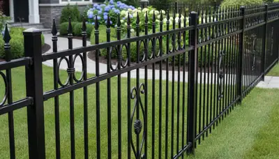 Black ornamental metal fence installation by Chop Chop Landscaping in Grand Rapids, MI